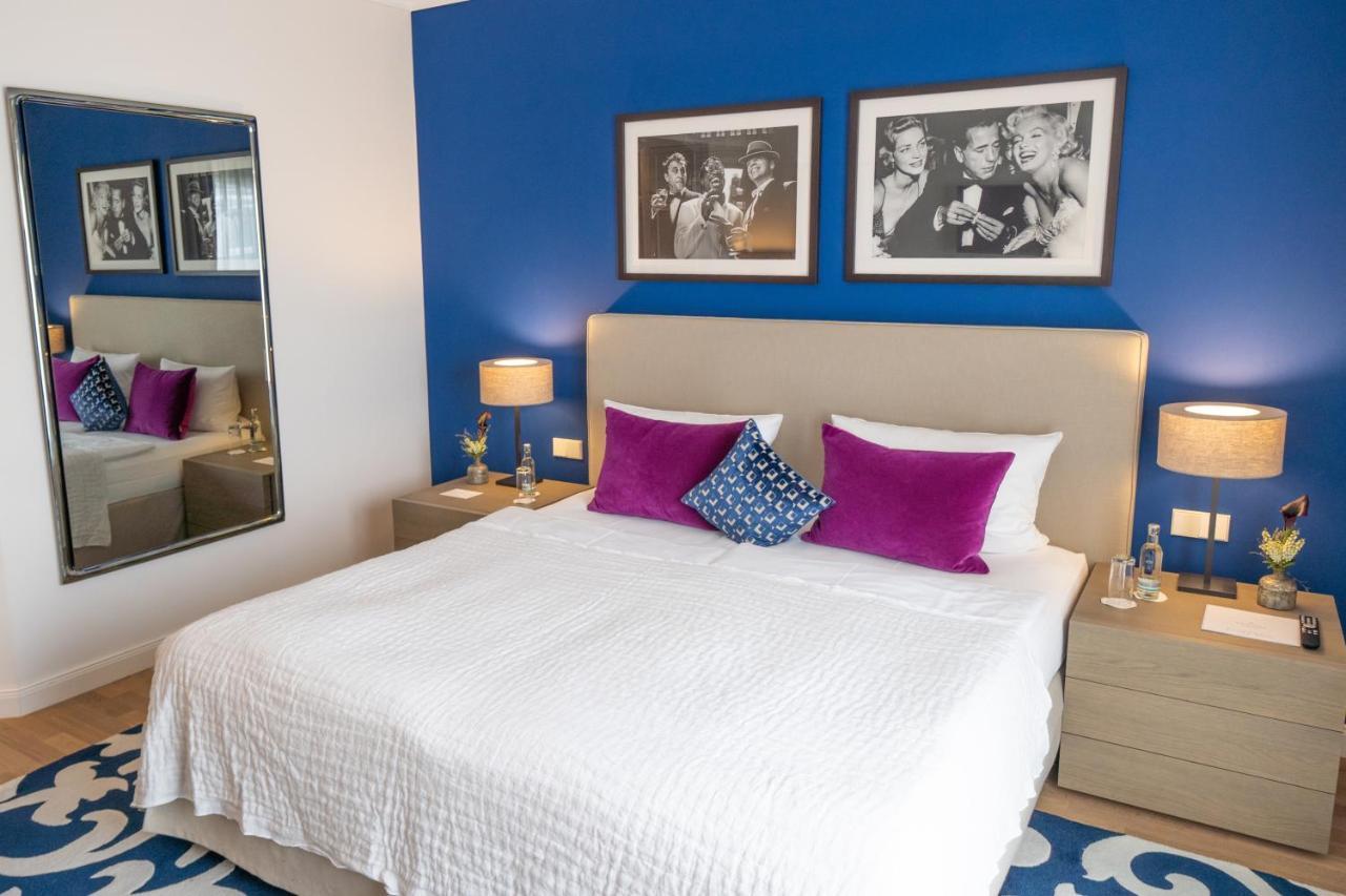 Vila Vita Rosenpark Marburg Ruang foto A bedroom at the hotel